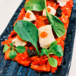 Carpaccio de pulpo marinado con pico de gallo y cítricos